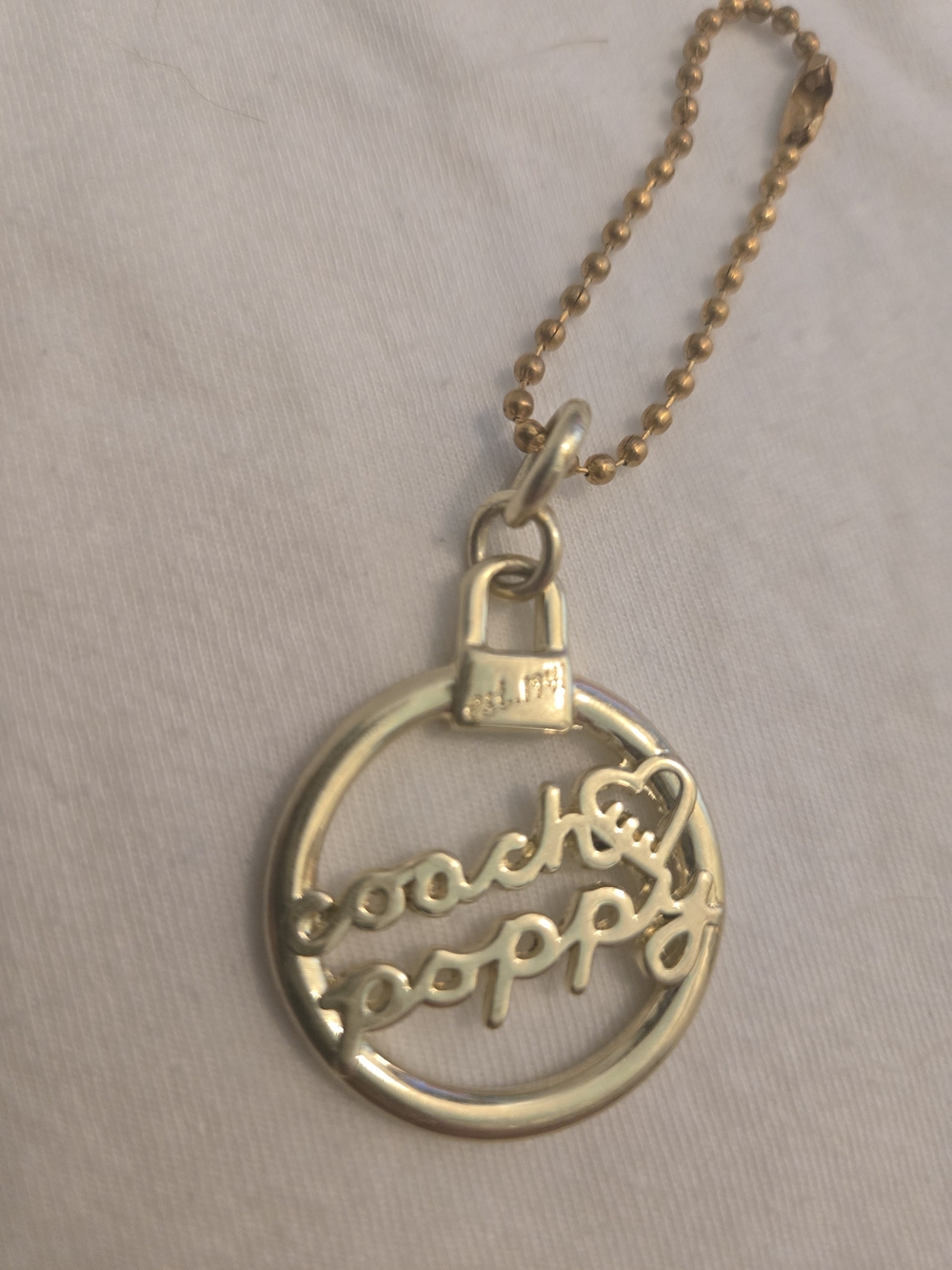 Coach Poppy Gold-Tone Hangtag